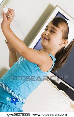 Side profile of a girl holding a sandwich View Large Photo Image Stock Photo - Side profile of a girl holding a sandwich. Fotosearch