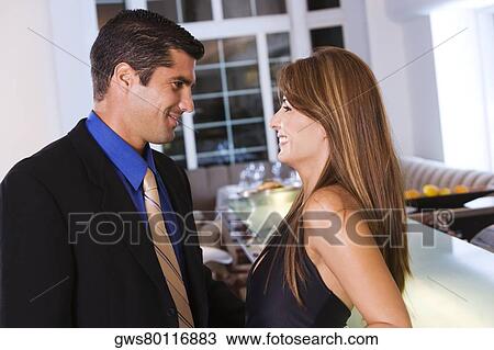 Side profile of a mid adult couple looking at each other View Large Photo Image Stock Image - Side profile of a mid adult couple looking at each other. Fotosearch