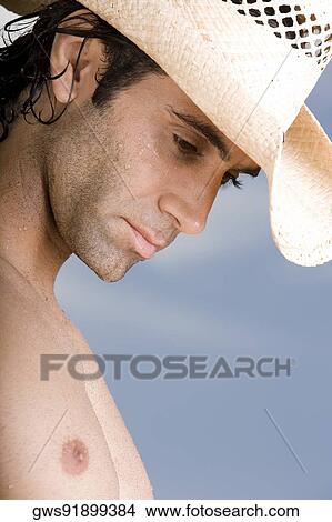Side profile of a mid adult man looking down View Large Photo Image Picture - Side profile of a mid adult man looking down. Fotosearch