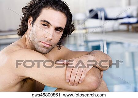 Side profile of a mid adult man sitting at the poolside View Large Photo Image Stock Image - Side profile of a mid adult man sitting at the poolside. Fotosearch