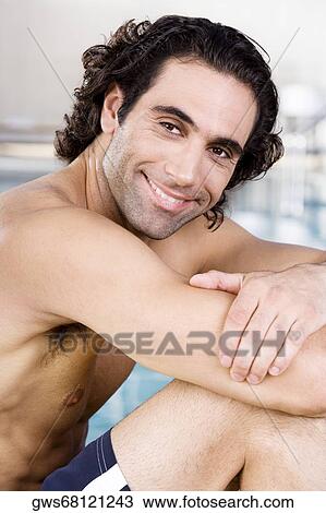 Side profile of a mid adult man sitting at the poolside View Large Photo Image Stock Image - Side profile of a mid adult man sitting at the poolside. Fotosearch