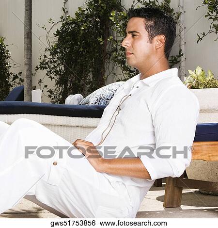 Stock Photograph - Side profile of a mid adult man thinking. Fotosearch
