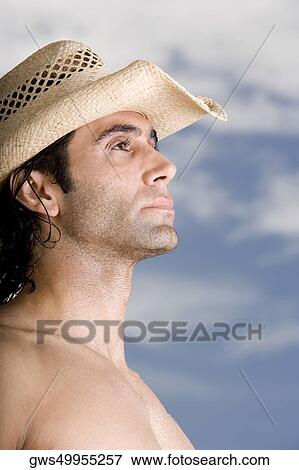 Side profile of a mid adult man wearing a hat View Large Photo Image Stock Photo - Side profile of a mid adult man wearing a hat. Fotosearch
