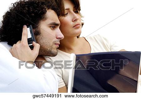 Side profile of a young couple looking down View Large Photo Image Stock Image - Side profile of a young couple looking down. Fotosearch