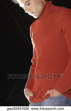 Side profile of a young man looking down View Large Photo Image Stock Photograph - Side profile of a young man looking down. Fotosearch