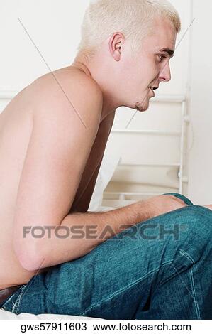 Side profile of a young man sitting View Large Photo Image Stock Image - Side profile of a young man sitting. Fotosearch