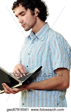 Side profile of a young man using a laptop View Large Photo Image Stock Image - Side profile of a young man using a laptop. Fotosearch