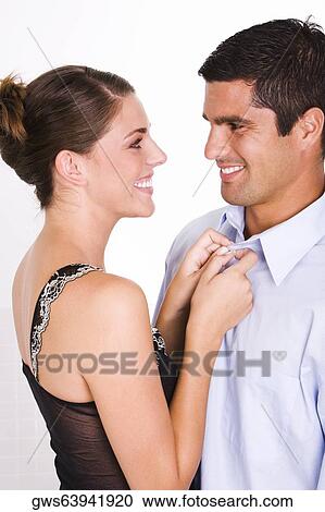 Side profile of a young woman and a mid adult man smiling View Large Photo Image Stock Image - Side profile of a young woman and a mid adult man smiling. Fotosearch