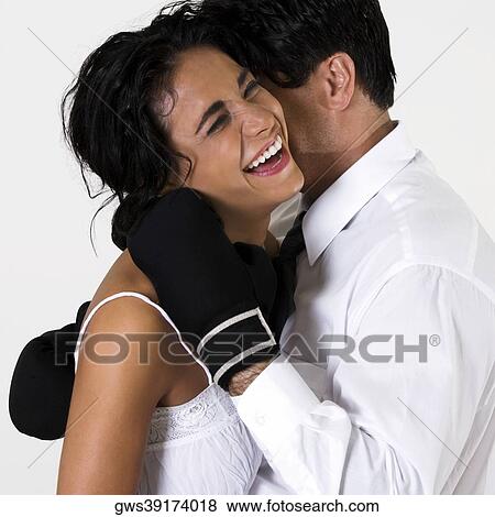 Side profile of a young woman and a mid adult man laughing View Large Photo Image Stock Photo - Side profile of a young woman and a mid adult man laughing. Fotosearch