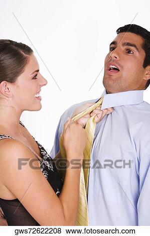 Side profile of a young woman choking a mid adult man with his tie View Large Photo Image Stock Photo - Side profile of a young woman choking a mid adult man with his tie. Fotosearch