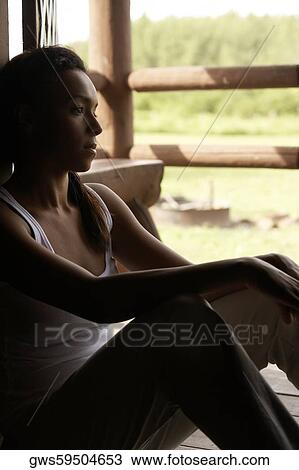 Side profile of a young woman sitting View Large Photo Image Stock Image - Side profile of a young woman sitting. Fotosearch
