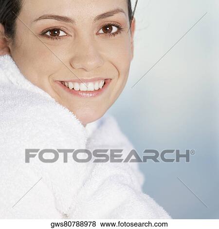 Side profile of a young woman wrapped in a towel View Large Photo Image Stock Photo - Side profile of a young woman wrapped in a towel. Fotosearch