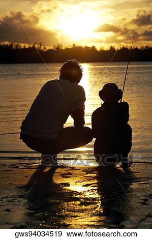 Silhouette of a father and his son fishing View Large Photo Image Stock Photo - Silhouette of a father and his son fishing. Fotosearch