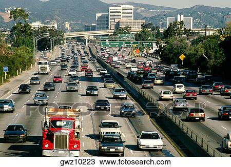 Traffic on Los Angeles highway and with office buildings in the background View Large Photo Image Stock Image - Traffic on Los Angeles highway and with office buildings in the background. Fotosearch