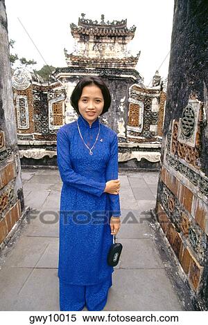 Woman in Ao Dai at Tomb of the Emperor Tu Duc in Hue, Vietnam View Large Photo Image Stock Photography - Woman in Ao Dai at Tomb of the Emperor Tu Duc in Hue, Vietnam. Fotosearch