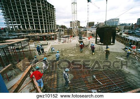 Workers on construction site pouring cement in new office building in Bethesda, Maryland View Large Photo Image Stock Image - Workers on construction site pouring cement in new office building in Bethesda, Maryland. Fotosearch