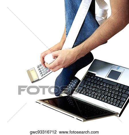 Young man holding a calculator near a laptop and a mobile phone View Large Photo Image Stock Image - Young man holding a calculator near a laptop and a mobile phone. Fotosearch