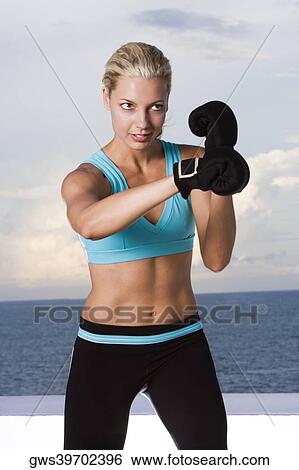 Young woman boxing View Large Photo Image Stock Photograph - Young woman boxing. Fotosearch