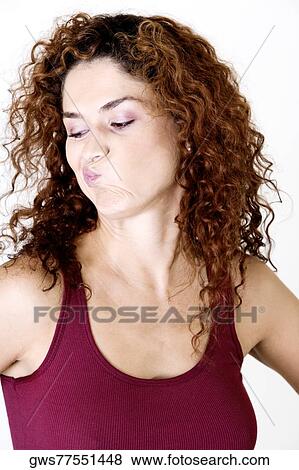 Stock Photo - Young woman making a face. Fotosearch