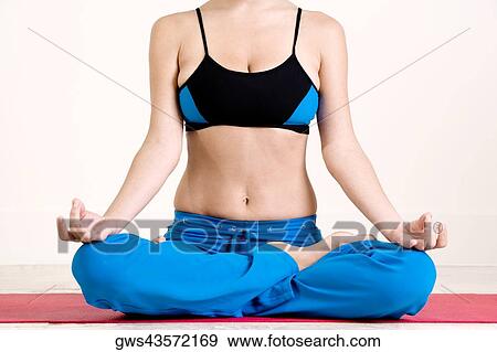 Young woman performing yoga View Large Photo Image Stock Photo - Young woman performing yoga. Fotosearch