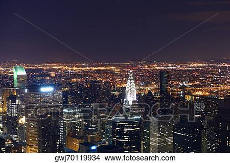 Picture - Aerial view of a city lit up at night, New York City, New York State, USA. Fotosearch