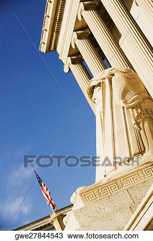 American flag in front of a building View Large Photo Image Stock Image - American flag in front of a building. Fotosearch
