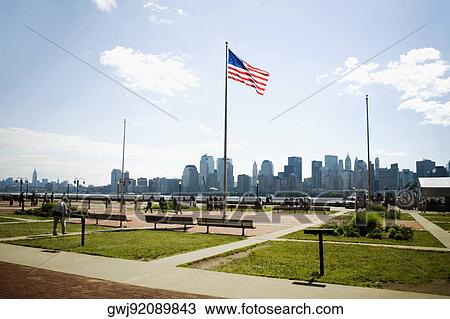 Stock Image - American flag in the park, Manhattan, New York City, New York State, USA. Fotosearch