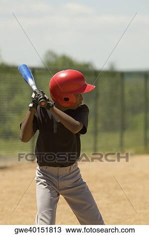 Baseball player swinging a baseball bat View Large Photo Image Stock Image - Baseball player swinging a baseball bat. Fotosearch