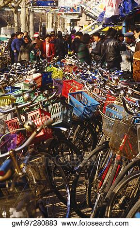 Stock Image - Bicycles in a parking lot, China. Fotosearch