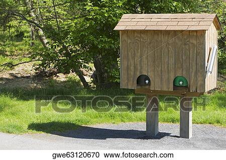 Stock Image - Birdhouse on the roadside. Fotosearch