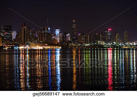 Buildings lit up at night, New York City, New York State, USA View Large Photo Image Stock Photo - Buildings lit up at night, New York City, New York State, USA. Fotosearch