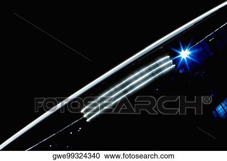 Buildings lit up at night View Large Photo Image Stock Image - Buildings lit up at night. Fotosearch