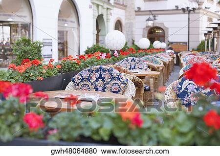 Chairs and tables in a cafe View Large Photo Image Stock Image - Chairs and tables in a cafe . Fotosearch