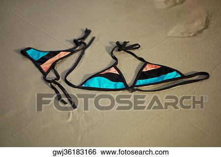 Close-up of a bikini on the beach View Large Photo Image Stock Photograph - Close-up of a bikini on the beach. Fotosearch