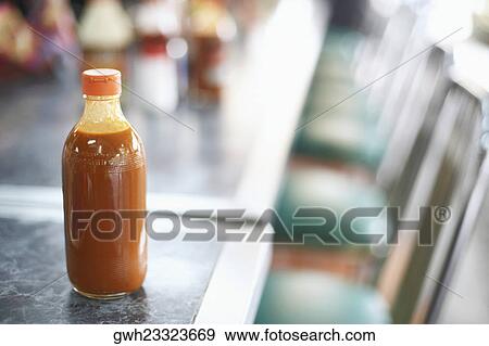 Close-up of a bottle of ketchup View Large Photo Image Stock Photo - Close-up of a bottle of ketchup. Fotosearch