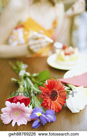 Close-up of a bunch of flowers on the table View Large Photo Image Stock Photograph - Close-up of a bunch of flowers on the table. Fotosearch