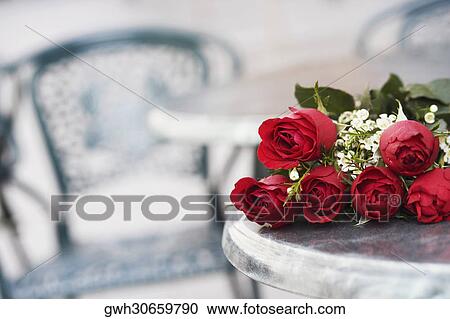 Close-up of a bunch of roses on a table View Large Photo Image Stock Image - Close-up of a bunch of roses on a table. Fotosearch