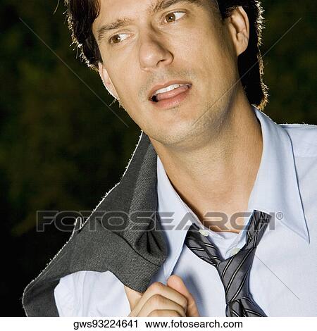 Close-up of a businessman looking away View Large Photo Image Stock Image - Close-up of a businessman looking away. Fotosearch