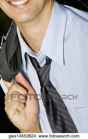 Close-up of a businessman smiling View Large Photo Image Picture - Close-up of a businessman smiling. Fotosearch