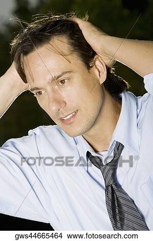 Picture - Close-up of a businessman smiling. Fotosearch