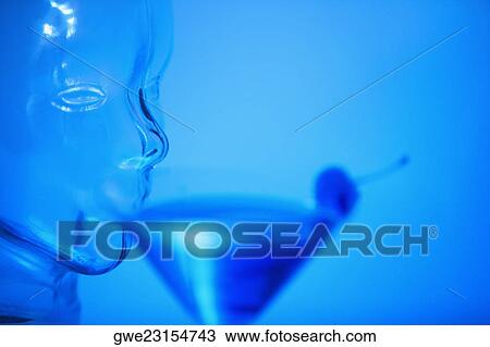 Close-up of a glass mannequin drinking a glass of martini View Large Photo Image Stock Image - Close-up of a glass mannequin drinking a glass of martini. Fotosearch
