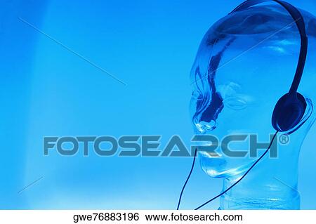 Close-up of a glass mannequin wearing headphones View Large Photo Image Stock Photograph - Close-up of a glass mannequin wearing headphones. Fotosearch