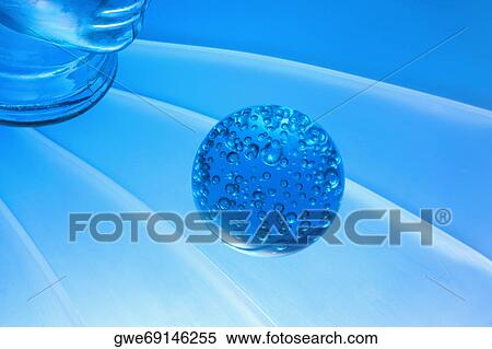 Close-up of a glass paperweight in front of a glass mannequin View Large Photo Image Stock Photography - Close-up of a glass paperweight in front of a glass mannequin. Fotosearch