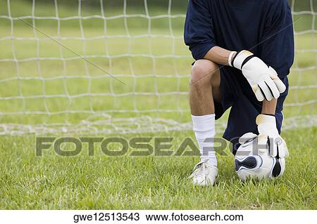 Close-up of a goalie touching a soccer ball View Large Photo Image Stock Image - Close-up of a goalie touching a soccer ball. Fotosearch
