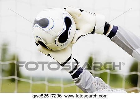 Close-up of a goalie's hands making a save View Large Photo Image Stock Photograph - Close-up of a goalie's hands making a save. Fotosearch