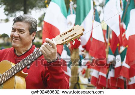Close-up of a mature man playing the guitar View Large Photo Image Stock Image - Close-up of a mature man playing the guitar. Fotosearch
