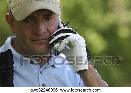 Close-up of a mature man using a mobile phone View Large Photo Image Stock Photograph - Close-up of a mature man using a mobile phone. Fotosearch