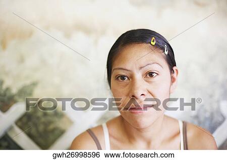 Close-up of a mature woman thinking View Large Photo Image Stock Photograph - Close-up of a mature woman thinking. Fotosearch