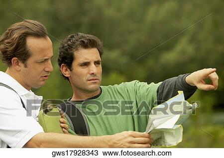 Close-up of a mid adult man and a mature man talking View Large Photo Image Stock Image - Close-up of a mid adult man and a mature man talking. Fotosearch