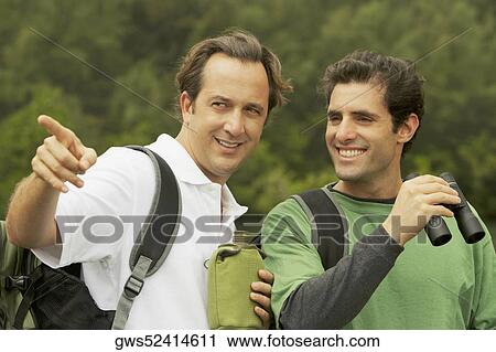 Close-up of a mid adult man and a mature man smiling View Large Photo Image Stock Image - Close-up of a mid adult man and a mature man smiling. Fotosearch